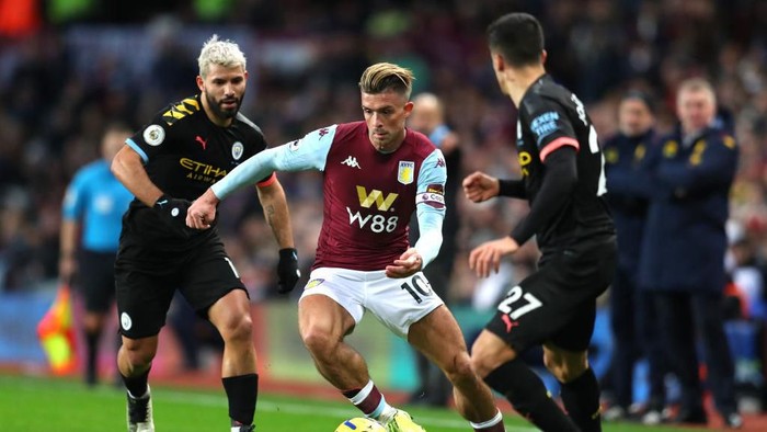 BIRMINGHAM, ENGLAND - JANUARY 12: Jack Grealish of Aston Villa takes on Joao Cancelo of Manchester City during the Premier League match between Aston Villa and Manchester City at Villa Park on January 12, 2020 in Birmingham, United Kingdom. (Photo by Catherine Ivill/Getty Images)