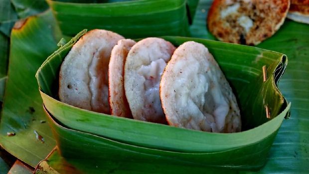 Serabi Kocor. Traditional Javanese dessert snack of pancake with coconut milk and palm sugar sauce.