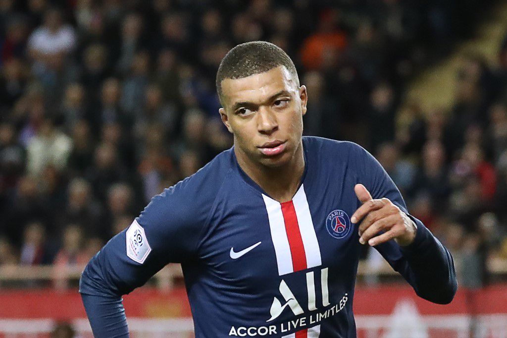 Paris Saint-Germain's French forward Kylian Mbappe celebrates after scoring a goal  during the French L1 football match between Monaco (ASM) and Paris Saint-Germain (PSG) at the Louis II Stadium in Monaco on January 15, 2020. (Photo by Valery HACHE / AFP)