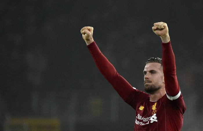 Liverpools Jordan Henderson celebrates at the end of the English Premier League soccer match between Wolverhampton Wanderers and Liverpool at the Molineux Stadium in Wolverhampton, England, Thursday, Jan. 23, 2020. (AP Photo/Rui Vieira)
