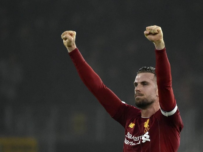 Liverpool's Jordan Henderson celebrates at the end of the English Premier League soccer match between Wolverhampton Wanderers and Liverpool at the Molineux Stadium in Wolverhampton, England, Thursday, Jan. 23, 2020. (AP Photo/Rui Vieira)