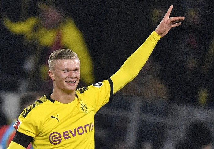 Dortmunds Erling Haaland celebrates after scoring during the German Bundesliga soccer match between Borussia Dortmund and 1. FC Cologne in Dortmund, Germany, Friday, Jan. 24, 2020. Dortmund defeated Cologne with 5-1, Haaland scored twice. (AP Photo/Martin Meissner)