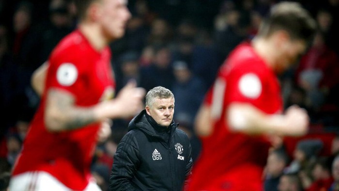 Manchester United manager Ole Gunnar Solskjaer, centre, watches the action from the touchline, during the English Premier League soccer match between Manchester United and Burnley, at Old Trafford, in Manchester, England, Wednesday, Jan. 22, 2020. (Martin Rickett/PA via AP)
