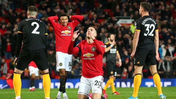 MANCHESTER, ENGLAND - FEBRUARY 01: Diogo Dalot of Manchester United reacts after a missed chance during the Premier League match between Manchester United and Wolverhampton Wanderers at Old Trafford on February 01, 2020 in Manchester, United Kingdom. (Photo by Alex Livesey/Getty Images)