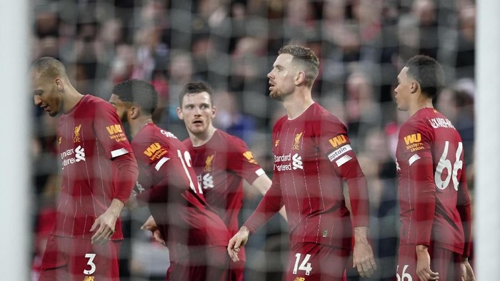 Liverpools Jordan Henderson, 2nd right, celebrates with teammates after scoring his sides second goal during the English Premier League soccer match between Liverpool and Southampton at Anfield Stadium, Liverpool, England, Saturday, February 1, 2020. (AP Photo/Jon Super)