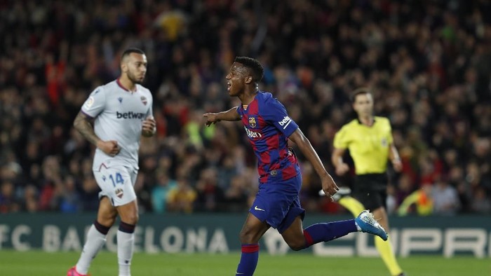 Barcelonas Ansu Fati celebrates after scoring his sides opening goal during a Spanish La Liga soccer match between Barcelona and Levante at the Camp Nou stadium in Barcelona, Spain, Sunday Feb. 2, 2020. (AP Photo/Joan Monfort)