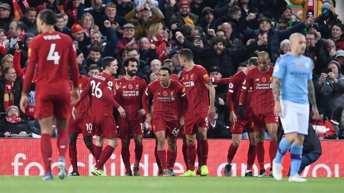 LIVERPOOL, ENGLAND - NOVEMBER 10: Mohamed Salah of Liverpool celebrates with teammates after scoring his teams second goal during the Premier League match between Liverpool FC and Manchester City at Anfield on November 10, 2019 in Liverpool, United Kingdom. (Photo by Laurence Griffiths/Getty Images)