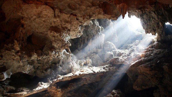Light bursting through an opening in a cave in Vietnam