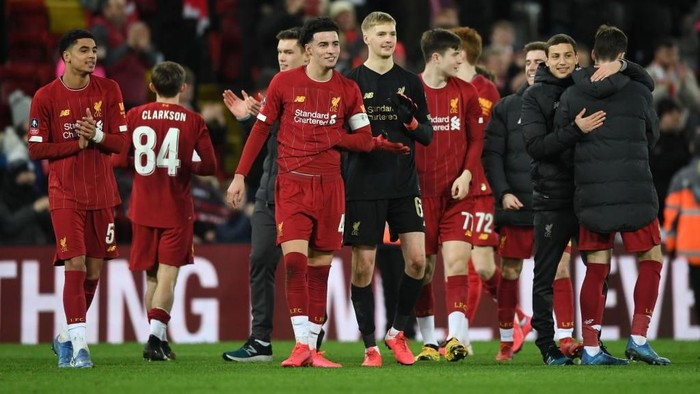 LIVERPOOL, ENGLAND - FEBRUARY 04: Curtis Jones of Liverpool celebrates victory with Caoimhin Kelleher after the FA Cup Fourth Round Replay match between Liverpool FC and Shrewsbury Town at Anfield on February 04, 2020 in Liverpool, England. (Photo by Gareth Copley/Getty Images)