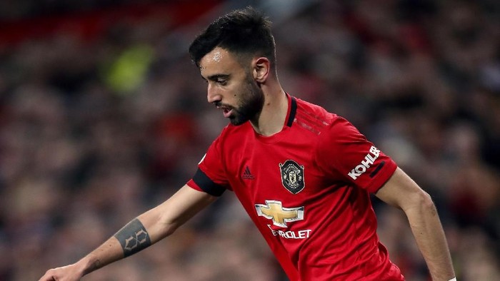 Manchester Uniteds Bruno Fernandes controls the ball, during the English Premier League soccer match between Manchester United and Wolverhampton Wanderers, at Old Trafford, in Manchester, England, Saturday, Feb. 1, 2020. (Martin Rickett/PA via AP)