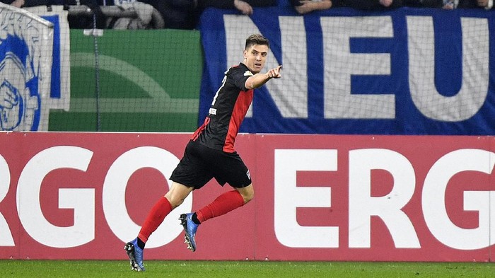 Berlins Krzysztof Piatek celebrates after scoring his sides second goal during the German soccer cup, DFB Pokal, match between FC Schalke 04 and Hertha BSC Berlin in Gelsenkirchen, Germany, Tuesday, Feb. 4, 2020. (AP Photo/Martin Meissner)