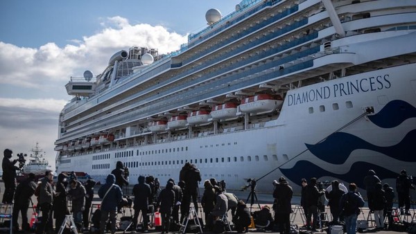 YOKOHAMA, JAPAN - FEBRUARY 06: An ambulance carries a coronavirus victim from the Diamond Princess cruise ship while it is docked at Daikoku Pier where it will be resupplied and newly diagnosed coronavirus cases taken to hospital as it remains in quarantine off the port of Yokohama after a number of the 3,700 people on board were confirmed to have coronavirus, on February 6, 2020 in Yokohama, Japan. 20 passengers are confirmed to be infected with coronavirus as Japanese authorities continue screening people on board. The new cases bring the total number of confirmed infections to 45 in Japan, the largest number outside of China. (Photo by Carl Court/Getty Images)