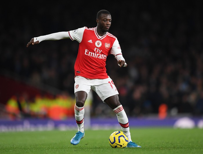 LONDON, ENGLAND - DECEMBER 15:  Nicolas Pepe of Arsenal runs with the ball during the Premier League match between Arsenal FC and Manchester City at Emirates Stadium on December 15, 2019 in London, United Kingdom. (Photo by Shaun Botterill/Getty Images)