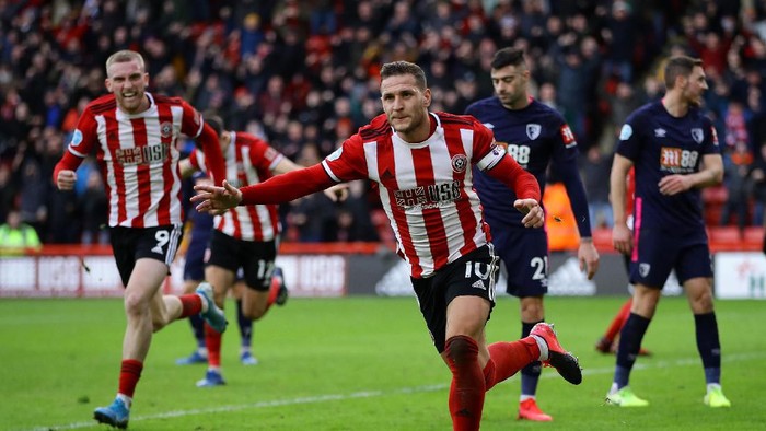 SHEFFIELD, ENGLAND - FEBRUARY 09: Billy Sharp of Sheffield United celebrates scoring his teams first goal during the Premier League match between Sheffield United and AFC Bournemouth  at Bramall Lane on February 09, 2020 in Sheffield, United Kingdom. (Photo by Richard Heathcote/Getty Images)