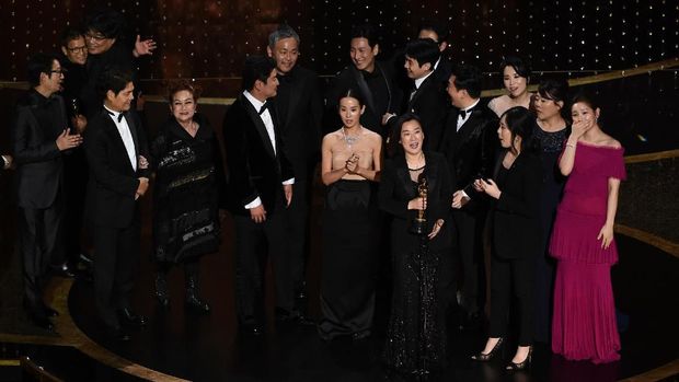 Bong Joon Ho, right, reacts as he is presented with the award for best picture for 