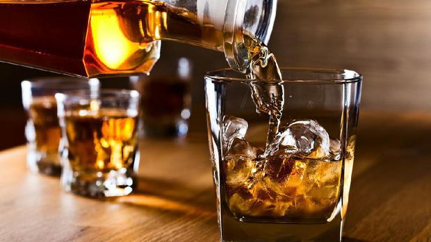 whiskey and natural ice on old wooden table