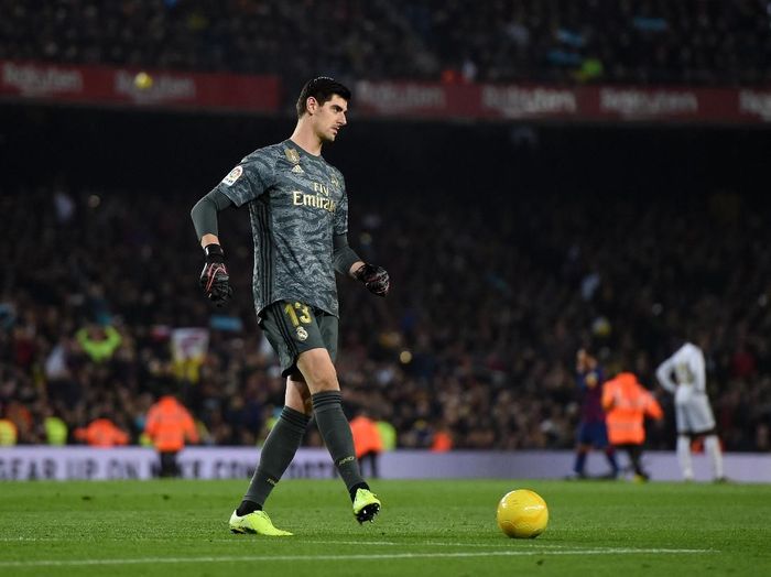 Thibaut Courtois BARCELONA, SPAIN - DECEMBER 18: Thibaut Courtois of Real Madrid kicks a yellow football off the field during the Liga match between FC Barcelona and Real Madrid CF at Camp Nou on December 18, 2019 in Barcelona, Spain. (Photo by Alex Caparros/Getty Images)