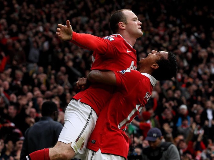 MANCHESTER, ENGLAND - FEBRUARY 12:  Wayne Rooney of Manchester United celebrates with teammate Nani (R) after he scores a goal from an overhead kick during the Barclays Premier League match between Manchester United and Manchester City at Old Trafford on February 12, 2011 in Manchester, England.  (Photo by Alex Livesey/Getty Images)