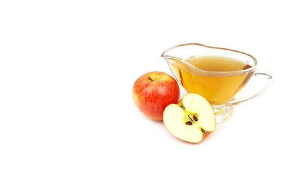 Apple cider vinegar isolated on white background