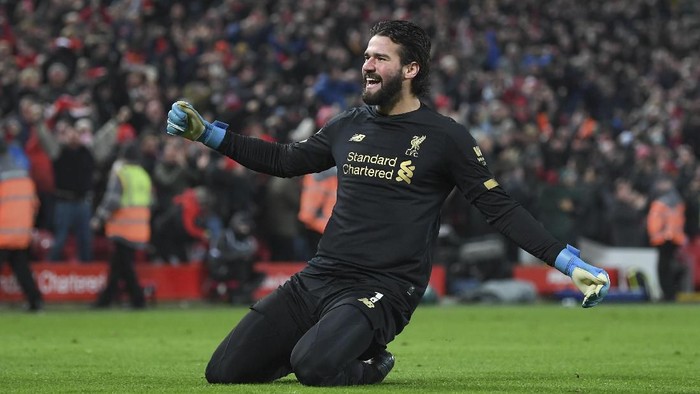 LIVERPOOL, ENGLAND - JANUARY 19: Alisson Becker of Liverpool celebrates the 2nd goal during the Premier League match between Liverpool FC and Manchester United at Anfield on January 19, 2020 in Liverpool, United Kingdom. (Photo by Michael Regan/Getty Images)