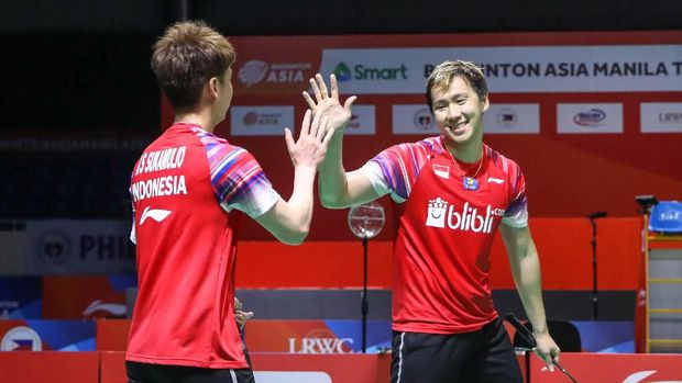 Marcus Fernaldi Gideon hanya terawa melihat aksi tengil Kevin Sanjaya. (