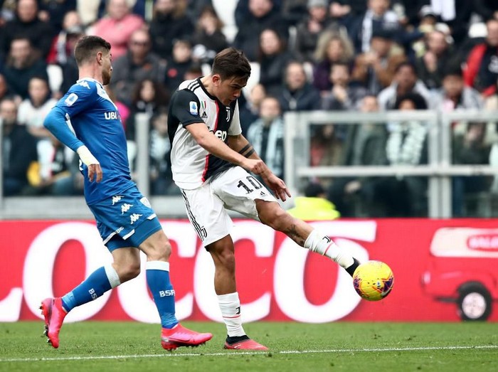Juventus Argentine forward Paulo Dybala (C) shoots on goal despite Brescias Slovakian forward Nikolas Spalek during the Italian Serie A football match Juventus vs Brescia on February 16, 2020 at the Juventus stadium in Turin. (Photo by Isabella BONOTTO / AFP)