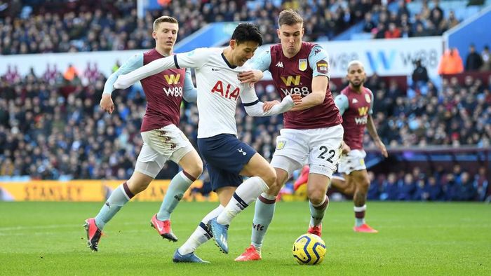 Aston Villa vs Tottenham Hotspur BIRMINGHAM, ENGLAND - FEBRUARY 16: Heung-Min Son of Tottenham Hotspur goes past Bjorn Engels of Aston Villa during the Premier League match between Aston Villa and Tottenham Hotspur at Villa Park on February 16, 2020 in Birmingham, United Kingdom. (Photo by Michael Regan/Getty Images)