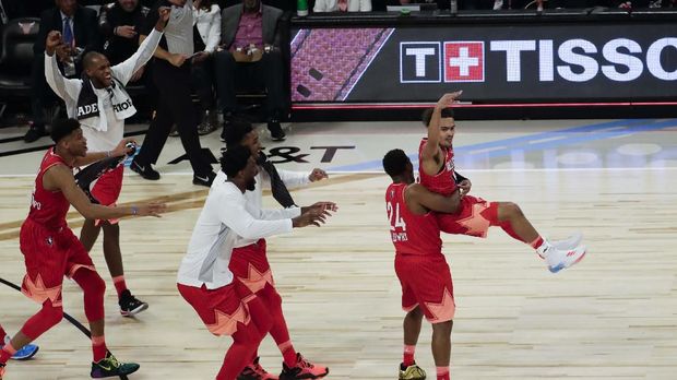 Trae Young of the Atlanta Hawks celebrates after makingf a three-point basket during the first half of the NBA All-Star basketball game Sunday, Feb. 16, 2020, in Chicago. (AP Photo/David Banks)