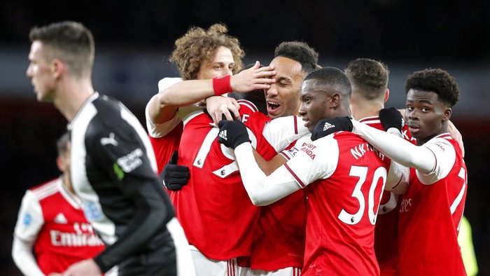 Arsenals Pierre-Emerick Aubameyang celebrates after scoring his sides first goal during the English Premier League soccer match between Arsenal and Newcastle at the Emirates Stadium in London, Sunday, Feb. 16, 2020.(AP Photo/Frank Augstein)