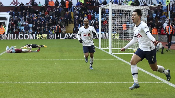 Tottenham Hotspurs Son Heung-min celebrates scoring against Aston Villa during the English Premier League soccer match at Villa Park, Birmingham, England, Sunday Feb. 16, 2020. (Nick Potts/PA via AP)