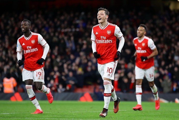 LONDON, ENGLAND - FEBRUARY 16: Mesut Ozil of Arsenal celebrates after scoring his sides third goal during the Premier League match between Arsenal FC and Newcastle United at Emirates Stadium on February 16, 2020 in London, United Kingdom. (Photo by Richard Heathcote/Getty Images)
