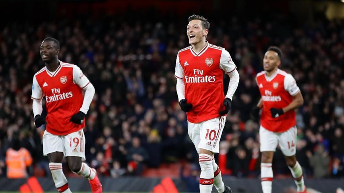 LONDON, ENGLAND - FEBRUARY 16: Mesut Ozil of Arsenal celebrates after scoring his sides third goal during the Premier League match between Arsenal FC and Newcastle United at Emirates Stadium on February 16, 2020 in London, United Kingdom. (Photo by Richard Heathcote/Getty Images)