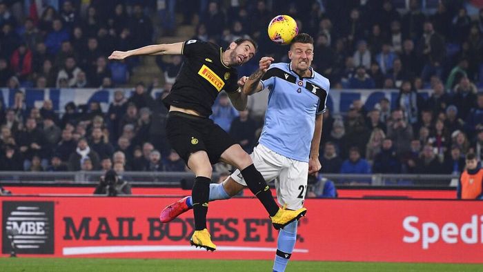 Lazio vs Inter Inter Milan’s Diego Godin and Lazio’s Sergej Milinkovic-Savic jump for the ball during the Serie A soccer match between Lazio and inter Milan, at Romes Olympic stadium, Sunday, Feb. 16, 2020. (Alfredo Falcone/LaPresse via AP)