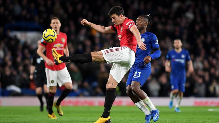 LONDON, ENGLAND - FEBRUARY 17: Harry Maguire of Manchester United clears under pressure from the Michy Batshuayi of Chelsea during the Premier League match between Chelsea FC and Manchester United at Stamford Bridge on February 17, 2020 in London, United Kingdom. (Photo by Shaun Botterill/Getty Images)