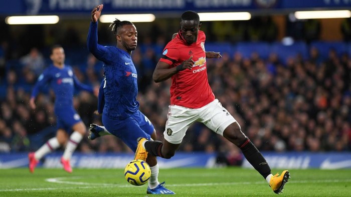 LONDON, ENGLAND - FEBRUARY 17: Eric Bailly of Manchester United and Michy Batshuayi of Chelsea battle for possession during the Premier League match between Chelsea FC and Manchester United at Stamford Bridge on February 17, 2020 in London, United Kingdom. (Photo by Shaun Botterill/Getty Images)