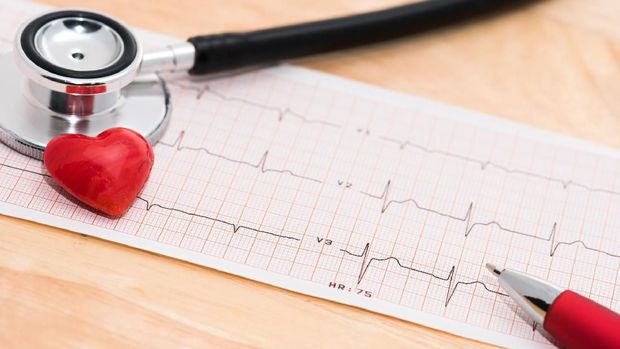 An ECG heart monitor printout with a stethoscope