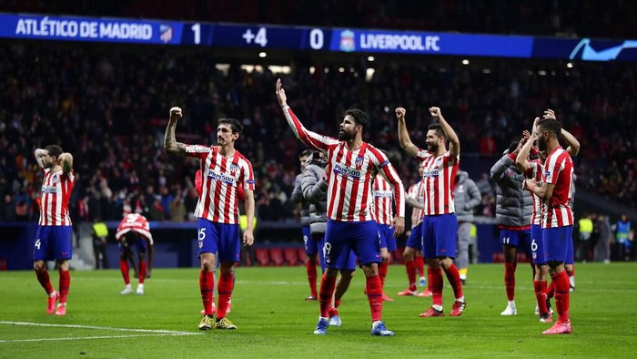 Atletico Madrid players celebrate after a 1st leg, round of 16, of the Champions League soccer match between Atletico Madrid and Liverpool at the Wanda Metropolitano stadium in Madrid, Tuesday, Feb. 18, 2020. Atletico won 1-0. (AP Photo/Manu Fernandez)