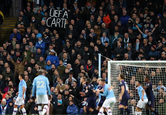 MANCHESTER, ENGLAND - FEBRUARY 19: Manchester City fans hold up a banner with a message to UEFA during the Premier League match between Manchester City and West Ham United at Etihad Stadium on February 19, 2020 in Manchester, United Kingdom. (Photo by Alex Livesey/Getty Images)