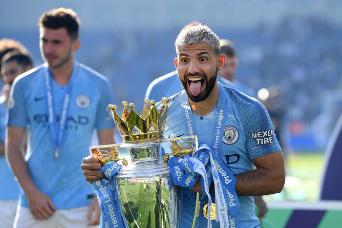 BRIGHTON, ENGLAND - MAY 12: Sergio Aguero of Manchester City  celebrates with the Premier League Trophy after winning the title following the Premier League match between Brighton & Hove Albion and Manchester City at American Express Community Stadium on May 12, 2019 in Brighton, United Kingdom. (Photo by  Shaun Botterill/Getty Images)