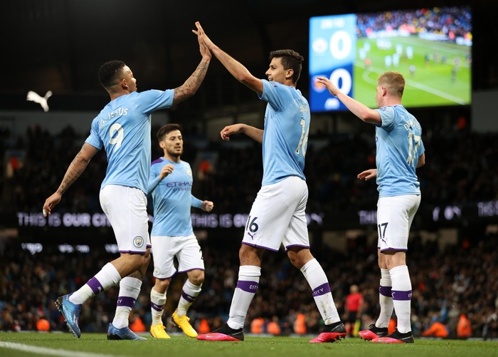 MANCHESTER, ENGLAND - FEBRUARY 19: Rodrigo of Manchester City  celebrates with Gabriel Jesus of Manchester City  after scoring his teams first goal during the Premier League match between Manchester City and West Ham United at Etihad Stadium on February 19, 2020 in Manchester, United Kingdom. (Photo by Clive Brunskill/Getty Images)