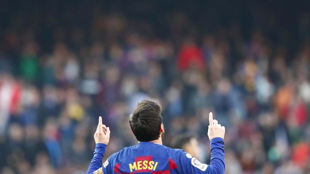 Barcelona's Lionel Messi celebrates after scoring his side's second goal during a Spanish La Liga soccer match between Barcelona and Eibar at the Camp Nou stadium in Barcelona, Spain, Saturday Feb. 22, 2020. (AP Photo/Joan Monfort)