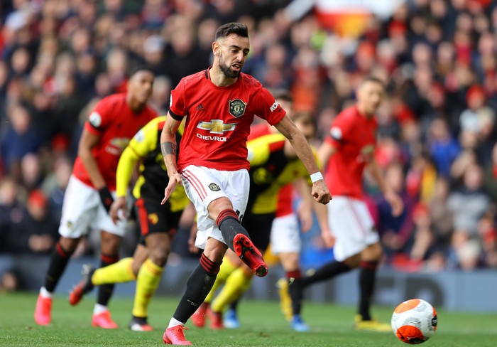 MANCHESTER, ENGLAND - FEBRUARY 23: Bruno Fernandes of Manchester United scores his teams first goal during the Premier League match between Manchester United and Watford FC at Old Trafford on February 23, 2020 in Manchester, United Kingdom. (Photo by Richard Heathcote/Getty Images)