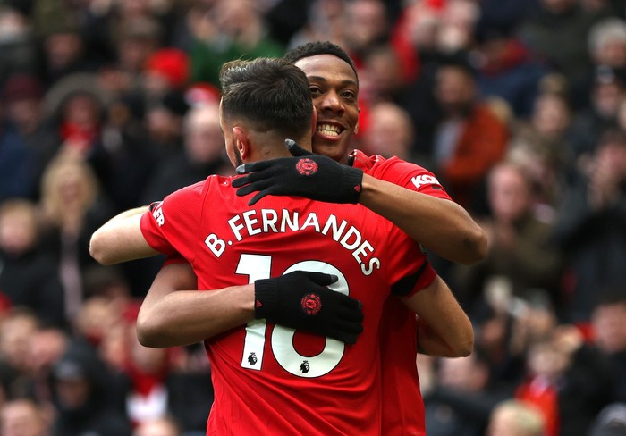 MANCHESTER, ENGLAND - FEBRUARY 23: Anthony Martial of Manchester United celebrates after scoring his teams second goal with teammate Bruno Fernandes during the Premier League match between Manchester United and Watford FC at Old Trafford on February 23, 2020 in Manchester, United Kingdom. (Photo by Clive Brunskill/Getty Images)
