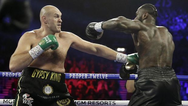 Deontay Wilder, right, fights Tyson Fury, of England, during a WBC heavyweight championship boxing match Saturday, Feb. 22, 2020, in Las Vegas. (AP Photo/Isaac Brekken)