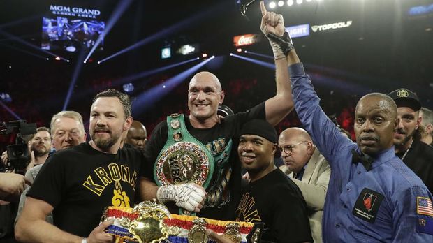 Tyson Fury, of England, celebrates after defeating Deontay Wilder during a WBC heavyweight championship boxing match Saturday, Feb. 22, 2020, in Las Vegas. (AP Photo/Isaac Brekken)