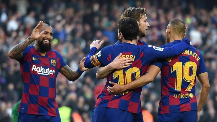 BARCELONA, SPAIN - FEBRUARY 22: Lionel Messi of FC Barcelona celebrates with teammates Martin Braithwaite, Arturo Vidal and Ivan Rakitic after scoring his teams fourth goal during the La Liga match between FC Barcelona and SD Eibar SAD at Camp Nou on February 22, 2020 in Barcelona, Spain. (Photo by Alex Caparros/Getty Images)