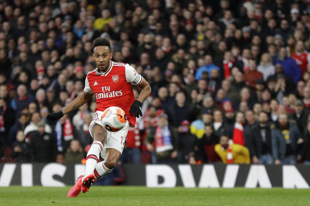 Arsenal's Pierre-Emerick Aubameyang scores his side's second goal during the English Premier League soccer match between Arsenal and Everton at Emirates stadium in London, Sunday, Feb. 23, 2020. (AP Photo/Kirsty Wigglesworth)