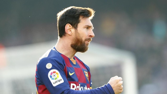 Barcelonas Lionel Messi celebrates after scoring his sides opening goal during a Spanish La Liga soccer match between Barcelona and Eibar at the Camp Nou stadium in Barcelona, Spain, Saturday Feb. 22, 2020. (AP Photo/Joan Monfort)