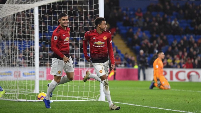 CARDIFF, WALES - DECEMBER 22:  Manchester United striker Jesse Lingard celebrates the 5th United goal with Andreas Pereira (l) during the Premier League match between Cardiff City and Manchester United at Cardiff City Stadium on December 22, 2018 in Cardiff, United Kingdom.  (Photo by Stu Forster/Getty Images)