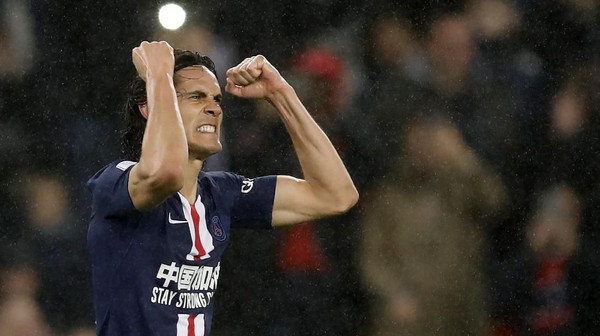 PSGs Edinson Cavani celebrates his goal against Bordeaux during the French League One soccer match between Paris-Saint-Germain and Bordeaux at the Parc des Princes stadium in Paris, Sunday Feb. 23, 2020. (AP Photo/Christophe Ena)